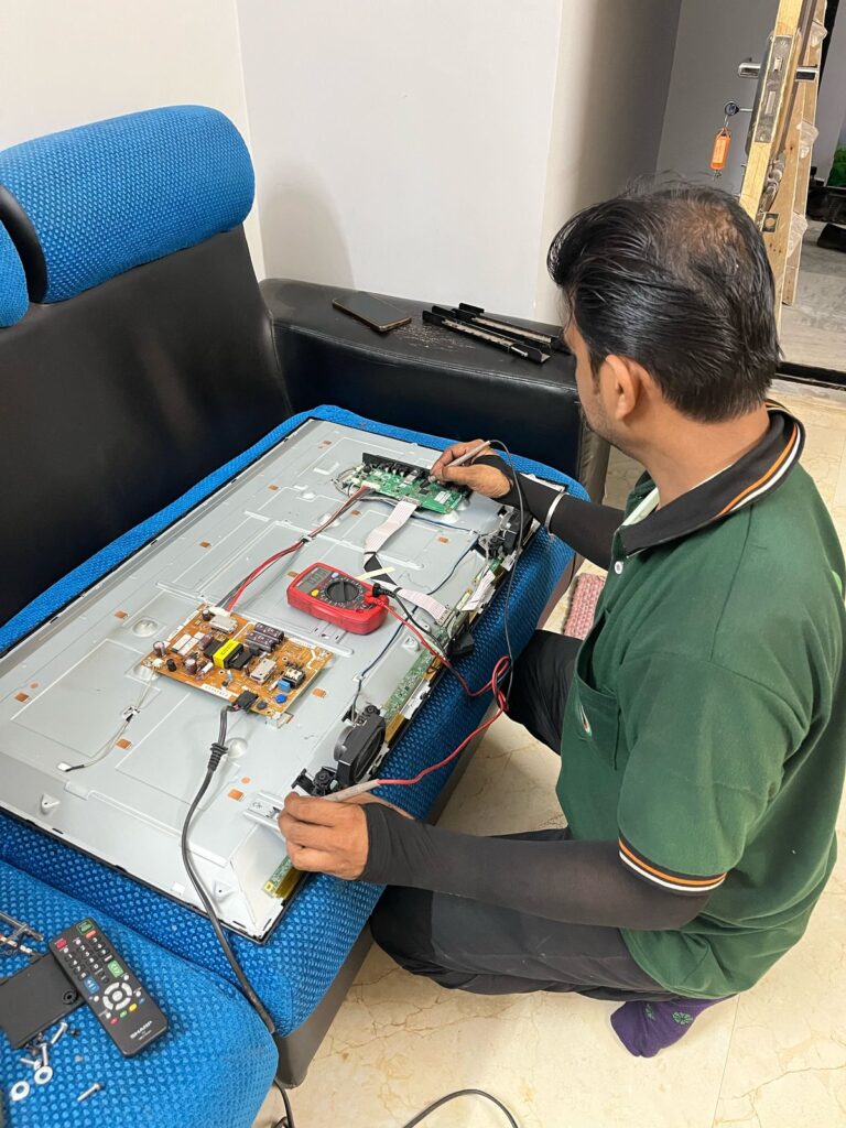 Our technician reparing LED TV at customer's location